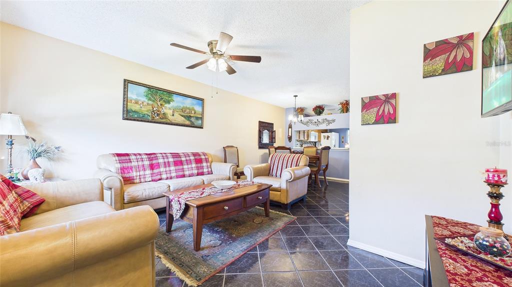 1250 Redondo Way Wesley Chapel, FL 33543 - Photo 9 of 27 a living room with furniture and a window