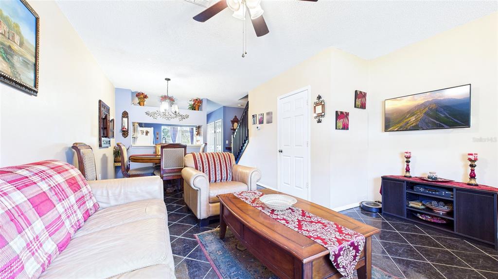 1250 Redondo Way Wesley Chapel, FL 33543 - Photo 10 of 27 a bedroom with furniture and a flat screen tv