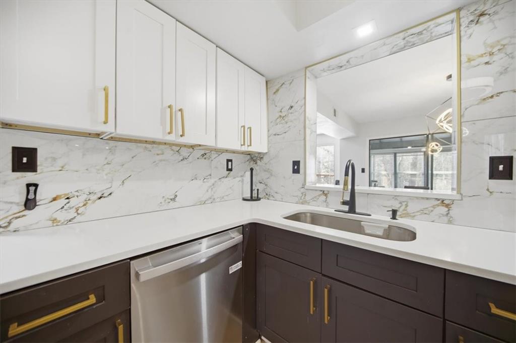 1039 Mariners Court Stone Mountain, GA 30083 - Photo 11 of 60 a kitchen with a sink cabinets and window