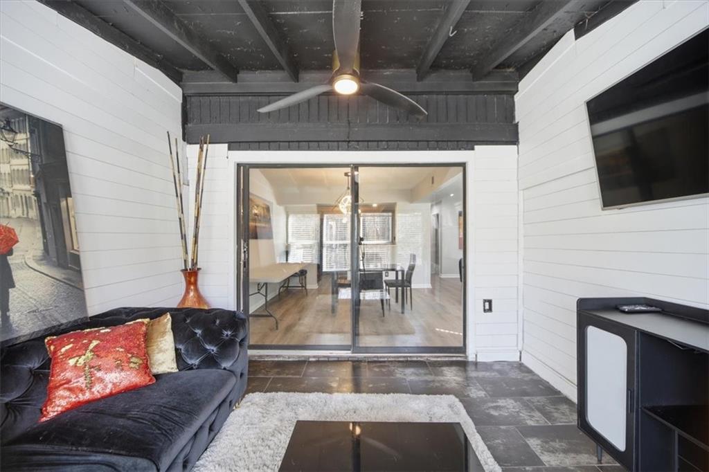 1039 Mariners Court Stone Mountain, GA 30083 - Photo 19 of 60 a living room with furniture and a flat screen tv