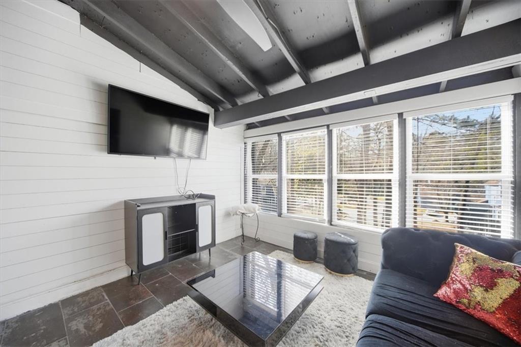 1039 Mariners Court Stone Mountain, GA 30083 - Photo 20 of 60 a living room with furniture floor and a flat screen tv