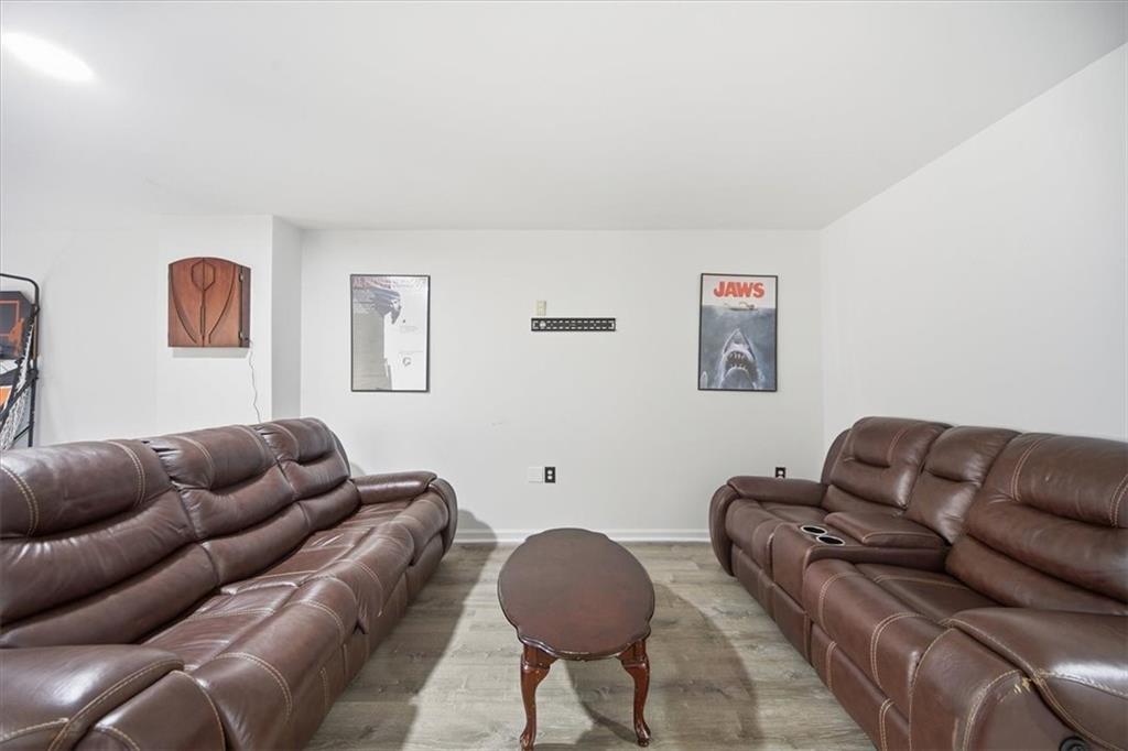 1039 Mariners Court Stone Mountain, GA 30083 - Photo 41 of 60 a living room with furniture and a couch