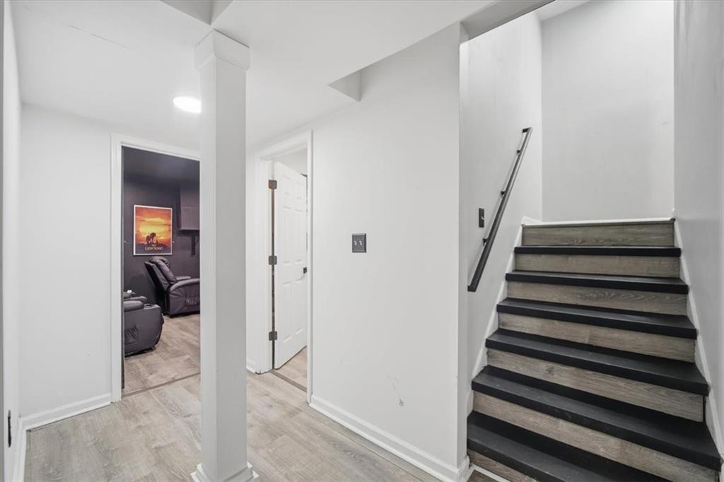 1039 Mariners Court Stone Mountain, GA 30083 - Photo 43 of 60 a view of a hallway with wooden floor and entryway