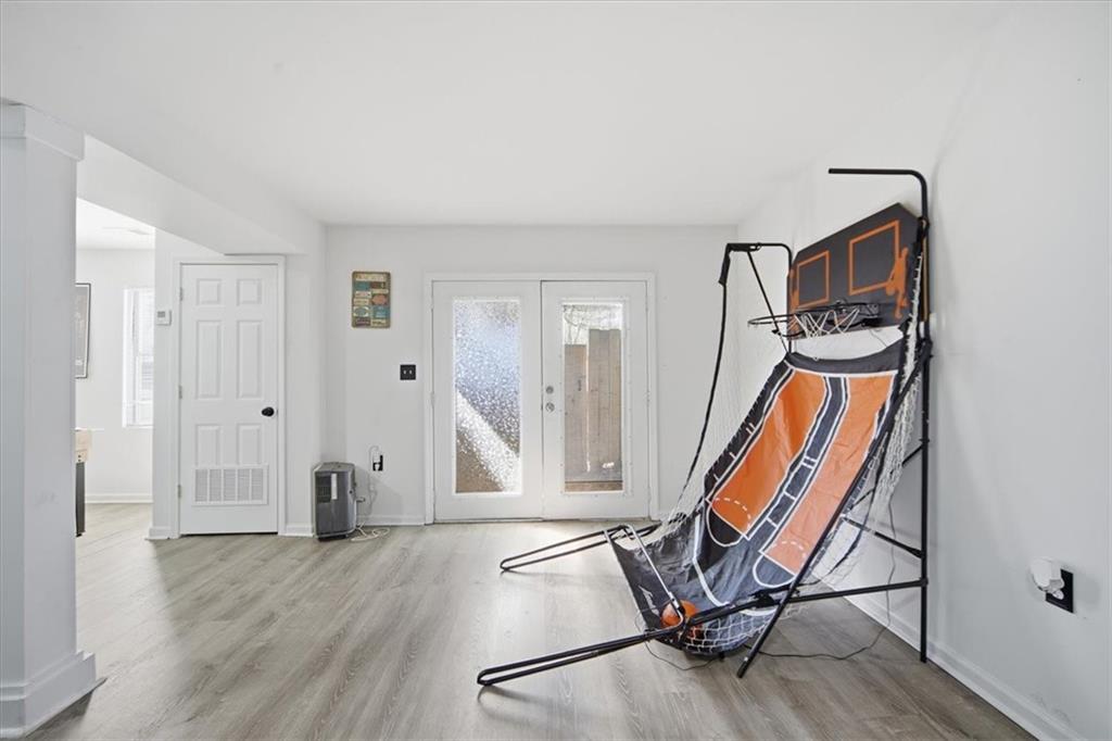 1039 Mariners Court Stone Mountain, GA 30083 - Photo 44 of 60 a view of an empty room with wooden floor and stairs