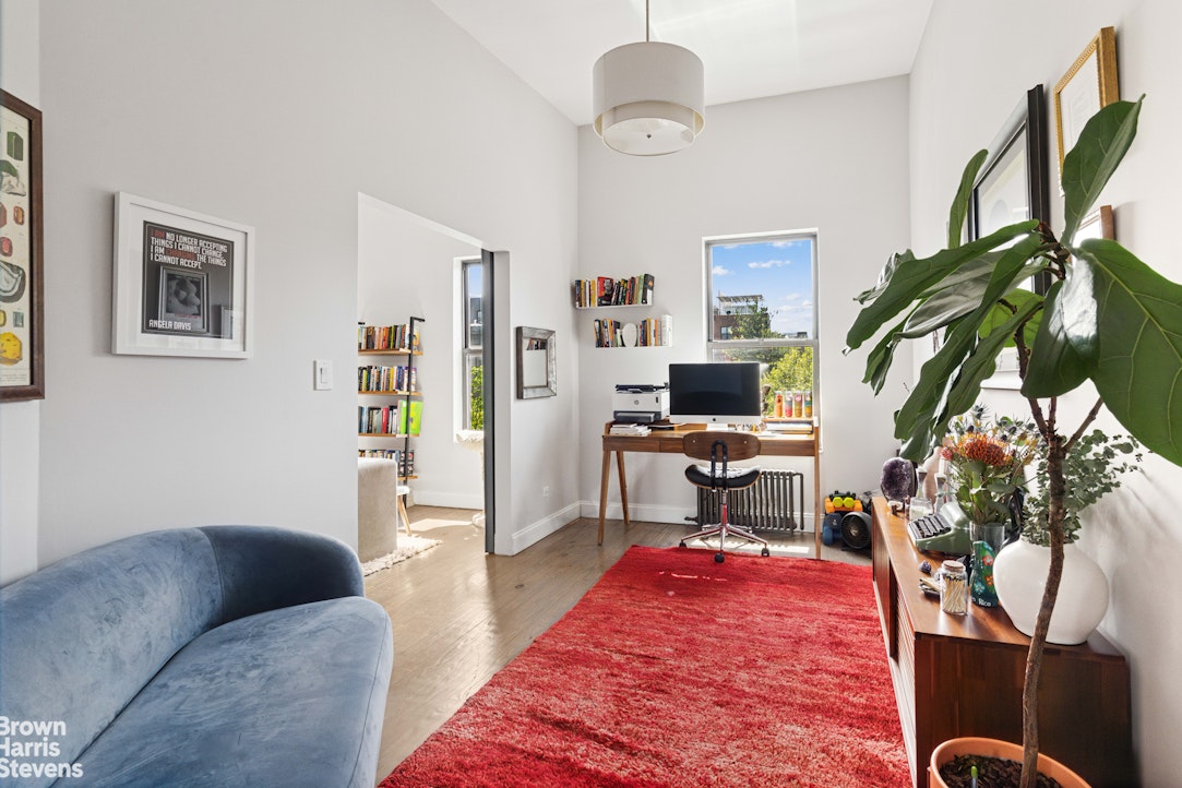 7 East 129th Street Manhattan, NY 10035 - Photo 10 of 24 a living room with furniture and a flat screen tv