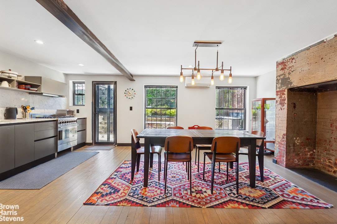 7 East 129th Street Manhattan, NY 10035 - Photo 12 of 24 a view of a dining room with furniture window and wooden floor