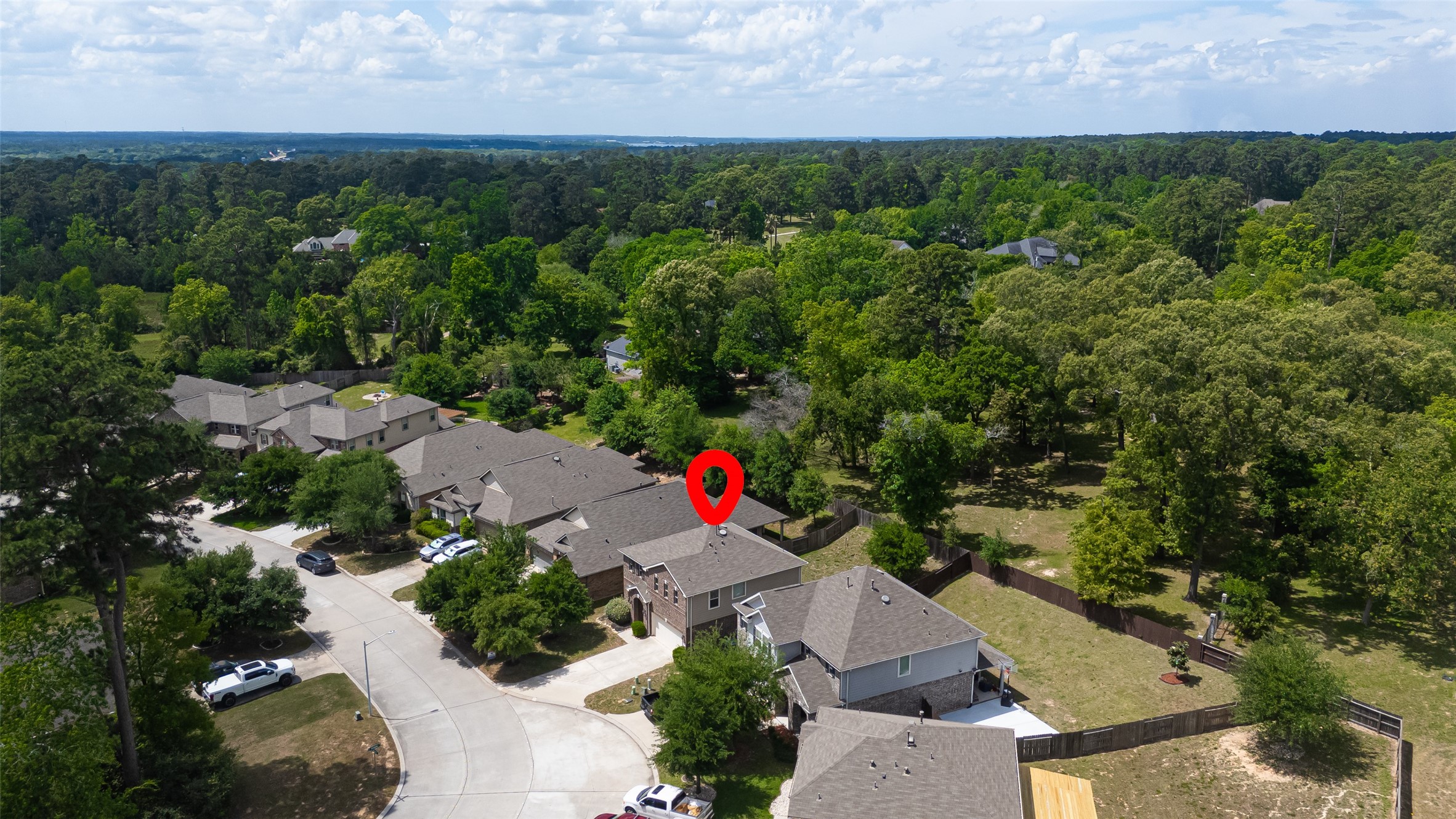2107 Parnevik Place Conroe, TX 77304 - Photo 41 of 44 Ideally positioned in a tranquil neighborhood, this home backs to expansive green space, combining suburban comfort with scenic surroundings just moments from everyday conveniences.