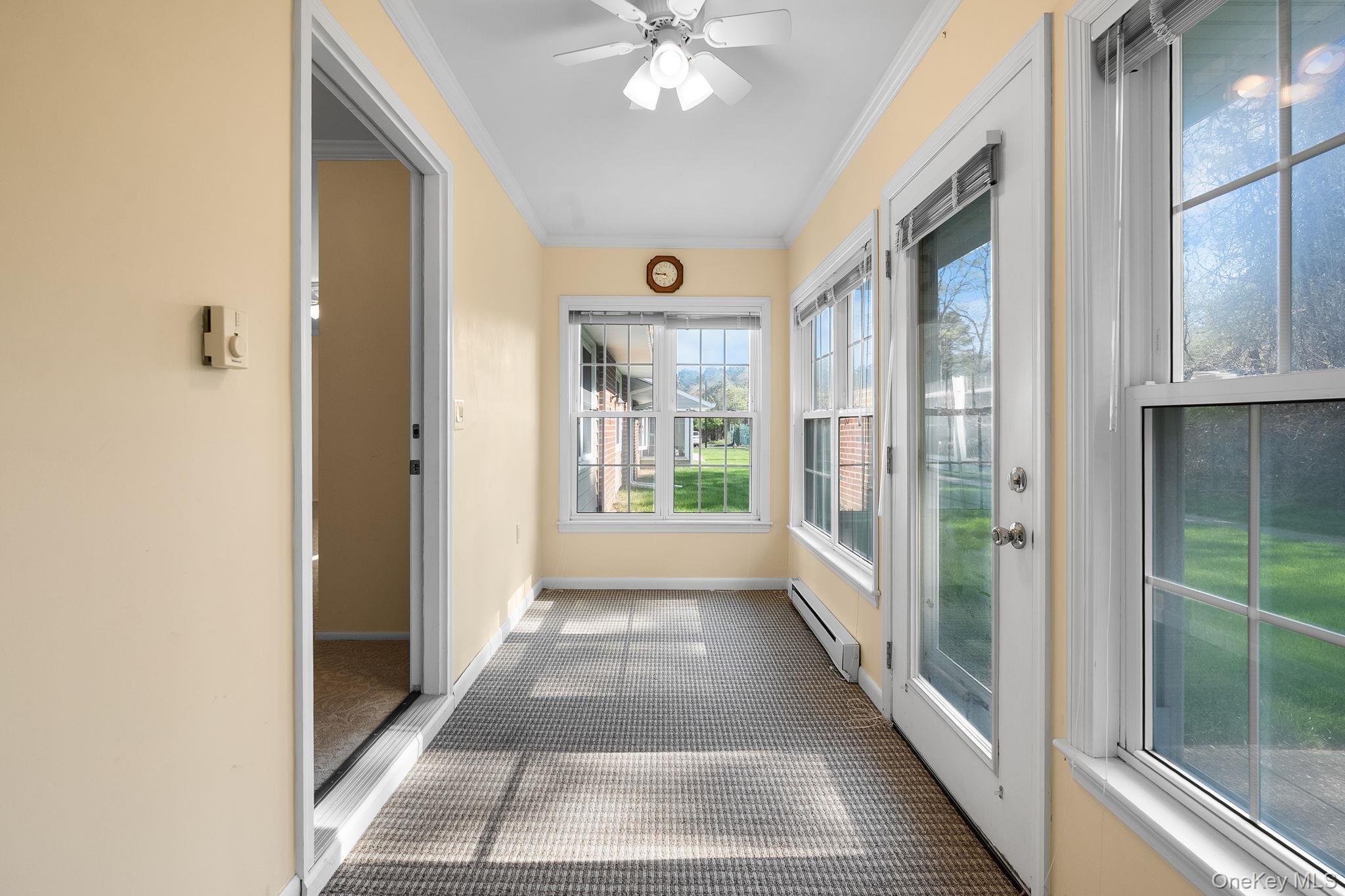 54 Aylesbury Court, Unit B Ridge, NY 11961 - Photo 13 of 22 Enclosed sunroom