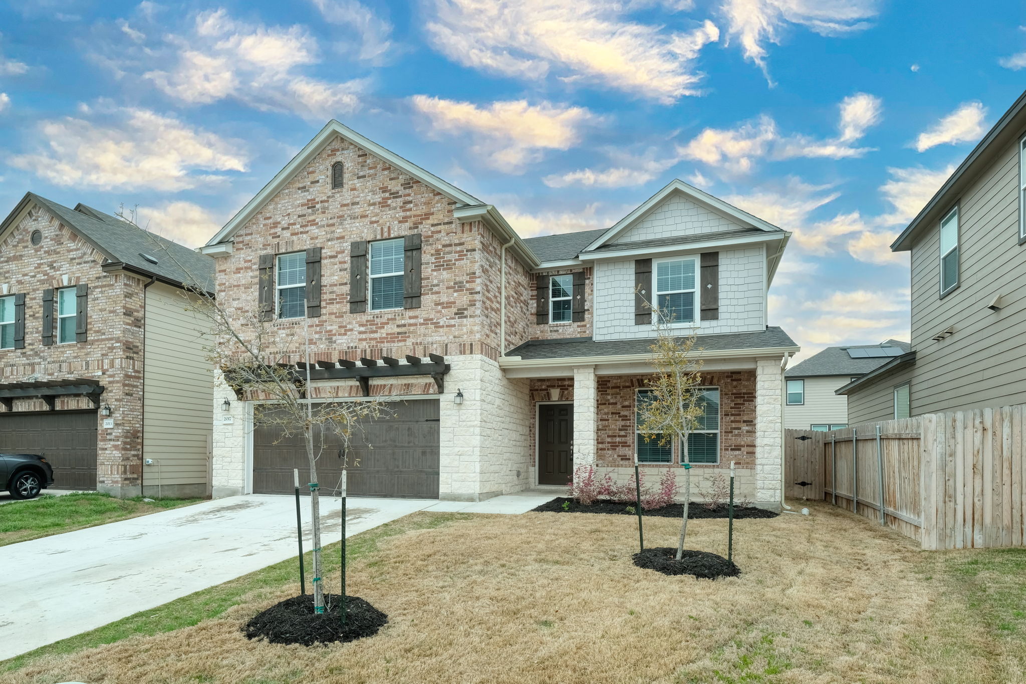 A classic brick exterior and covered front porch create remarkable curb appeal.