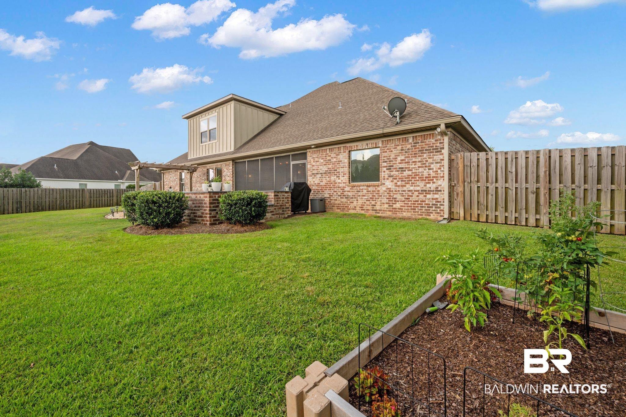418 Fortune Drive Fairhope, AL 36532 - Photo 54 of 63 Rear view of property with central AC unit, a sunroom, and a yard