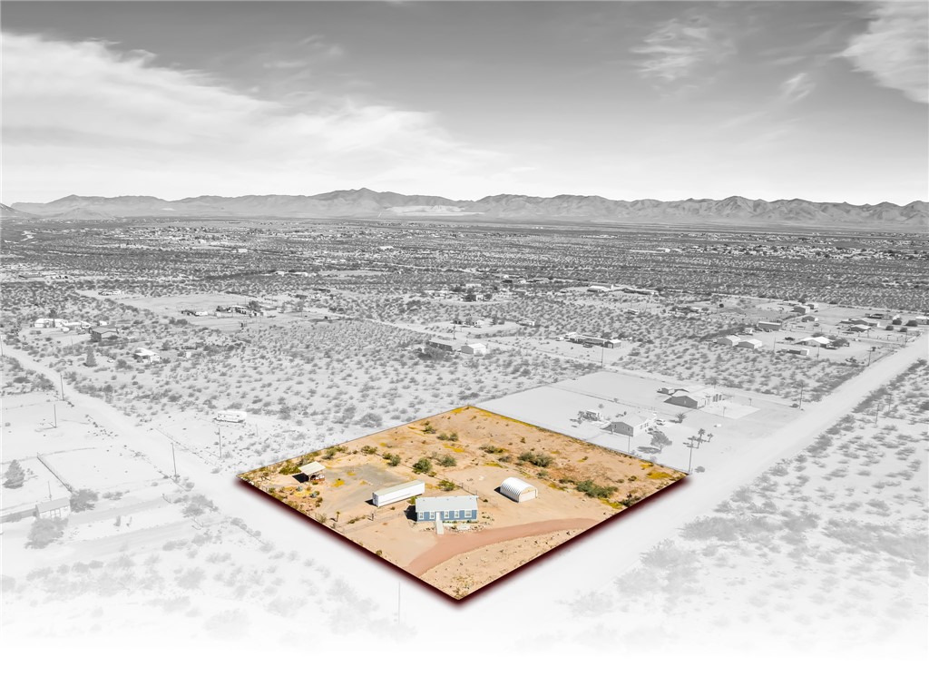 3534 Eloy Road Golden Valley, AZ 86413 - Photo 55 of 58 Aerial view of property's location with a mountainous background and property parcel outlined