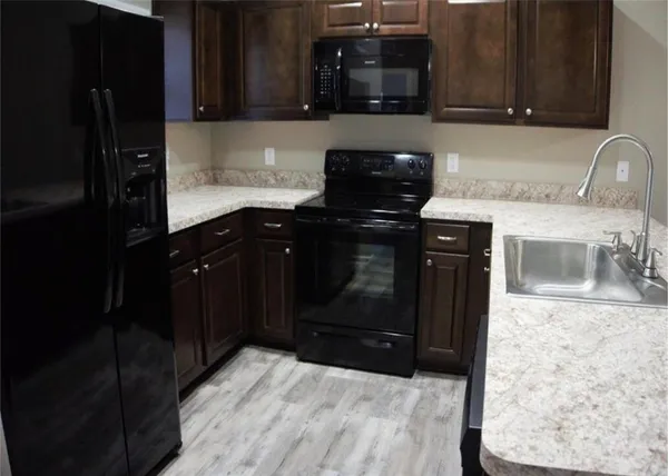 a kitchen with a sink and cabinets