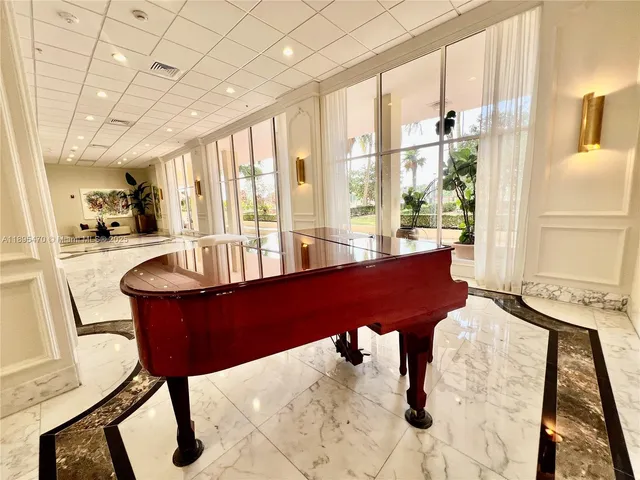 a view of a swimming pool with outdoor seating