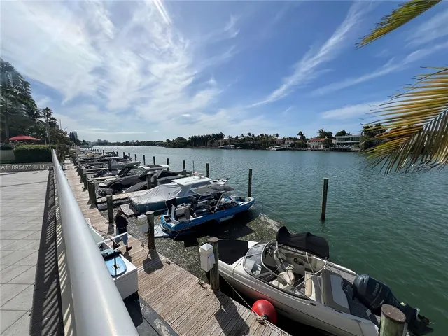 a view of a patio with table and chairs potted plants