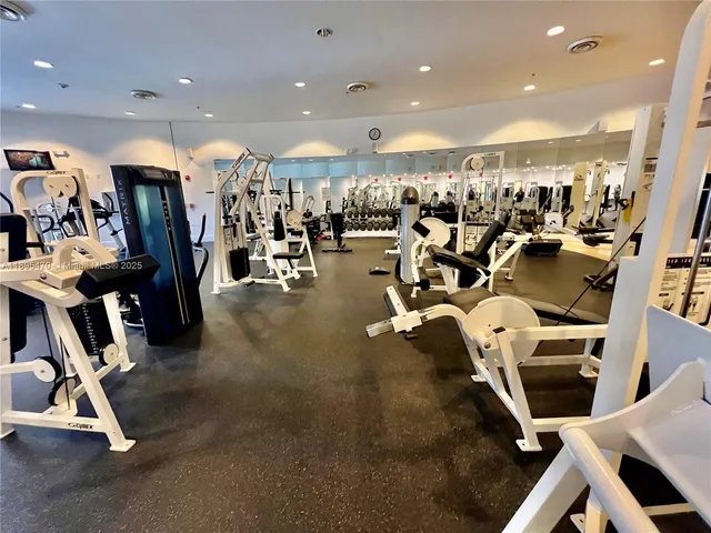 a living room with furniture a large window