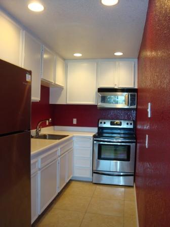 2857 North Los Felices Road, Unit 217 Palm Springs, CA 92262 - Photo 1 of 12 a kitchen with a stove and a refrigerator
