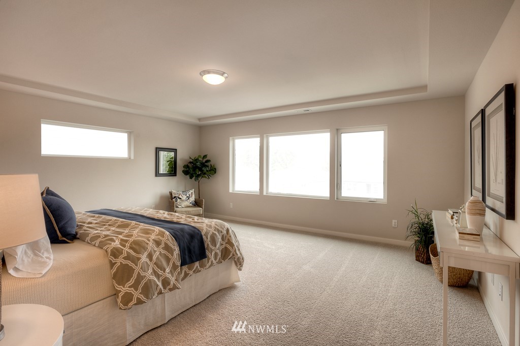 2121 228th Place Southwest, Unit EP 11 Bothell, WA 98021 - Photo 7 of 27 a bedroom with a bed and window