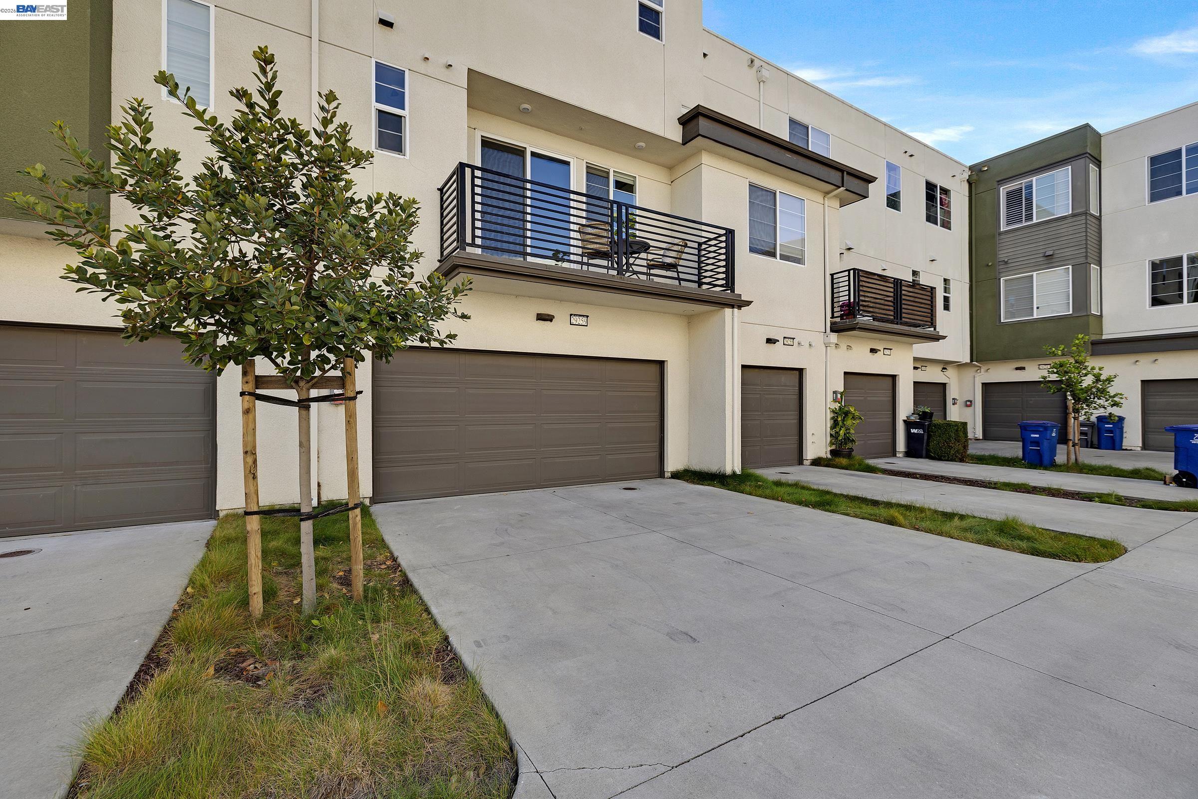 29259 Hub Court Hayward, CA 94544 - Photo 3 of 34 a front view of a house with a yard and garage