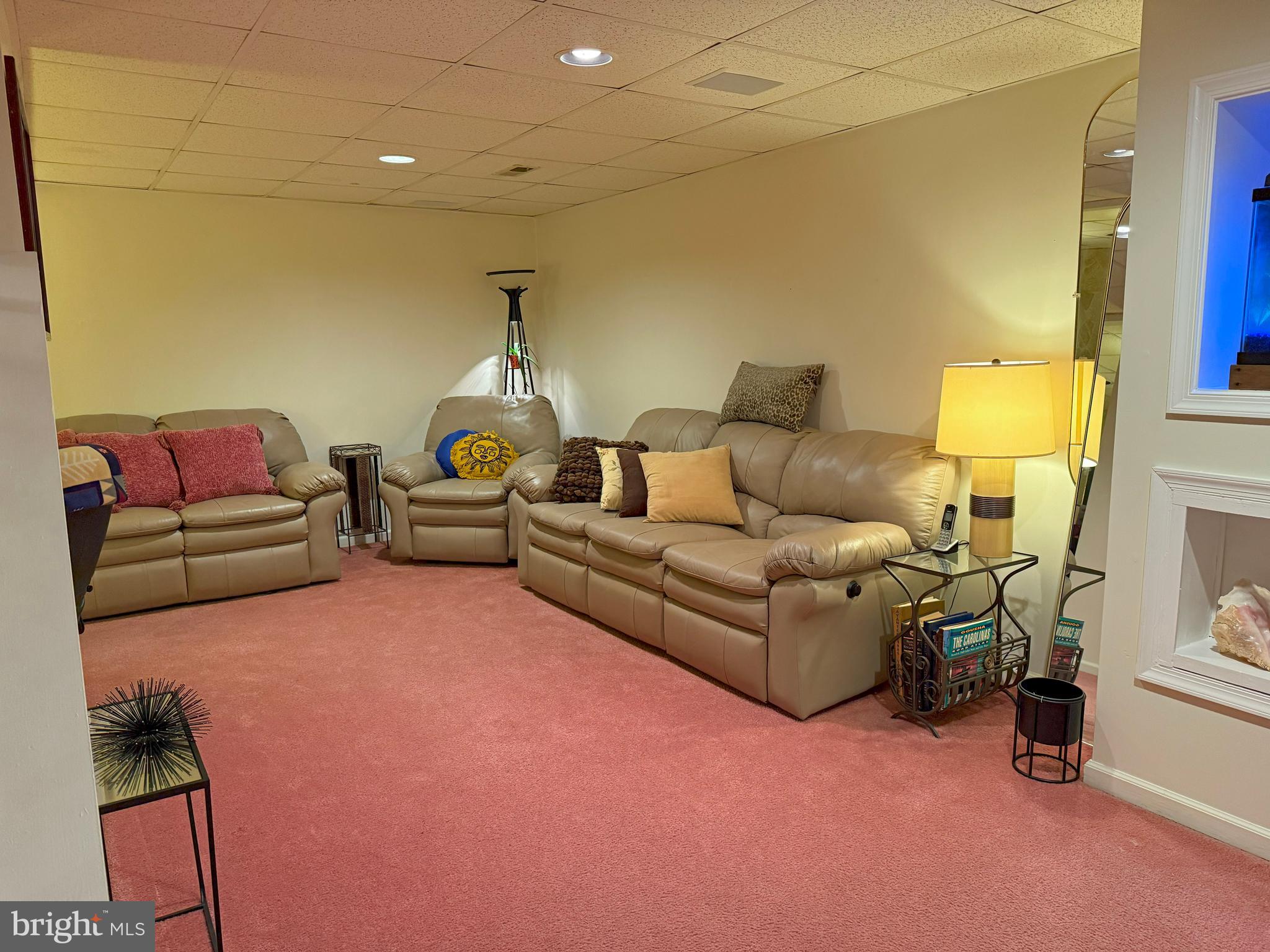 22 Chilmark Court Bear, DE 19701 - Photo 21 of 29 a living room with furniture and a chandelier