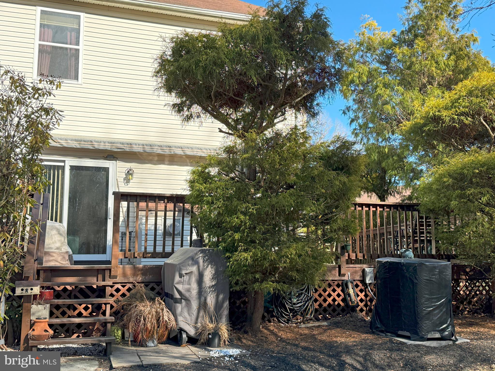 22 Chilmark Court Bear, DE 19701 - Photo 26 of 29 a view of backyard with barbeque grill and wooden fence