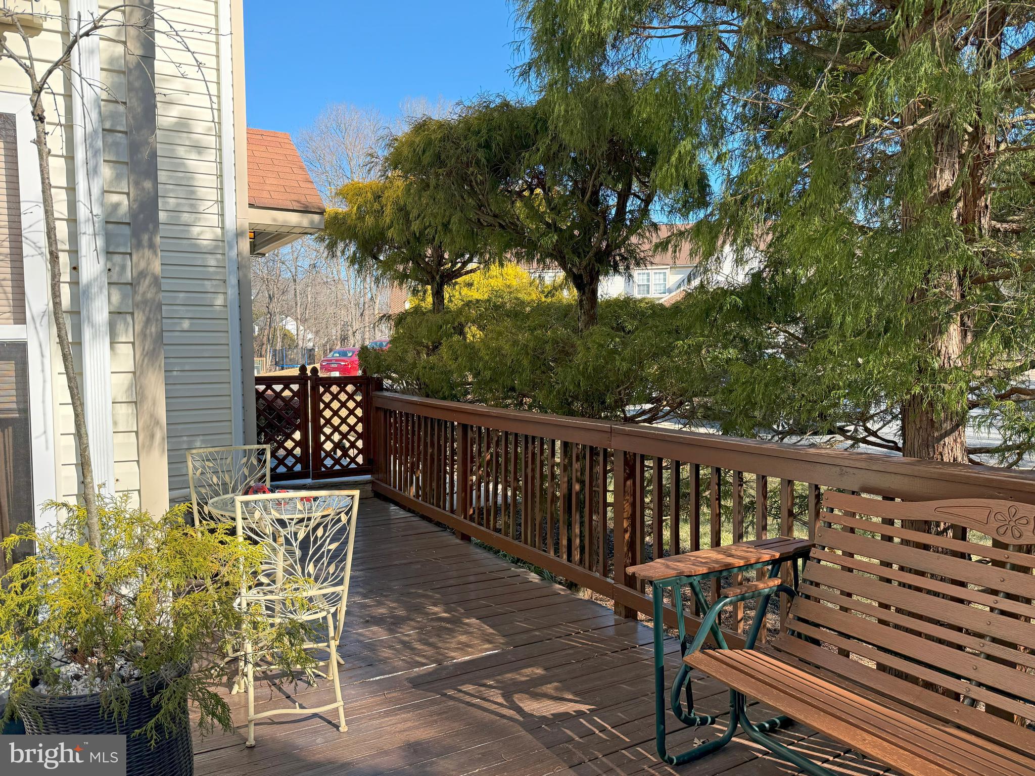 22 Chilmark Court Bear, DE 19701 - Photo 28 of 29 a view of a chairs and table on the wooden roof deck