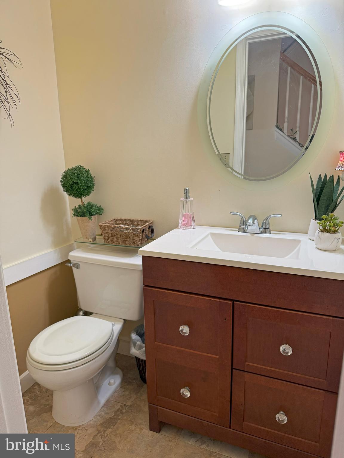22 Chilmark Court Bear, DE 19701 - Photo 5 of 29 a bathroom with a toilet a sink and mirror
