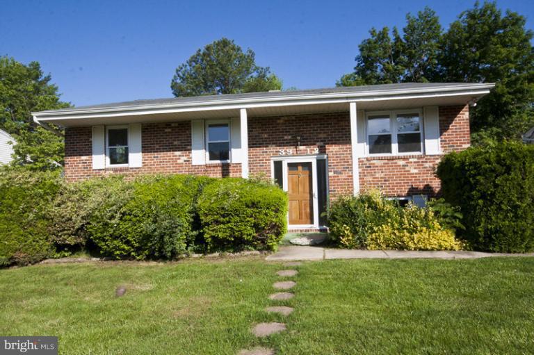 3912 Sybil Road Randallstown, MD 21133 - Photo 18 of 18 a front view of a house with a yard