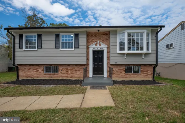 a front view of a house with garage