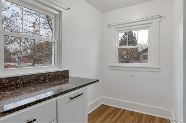 a view of wooden floor and a window