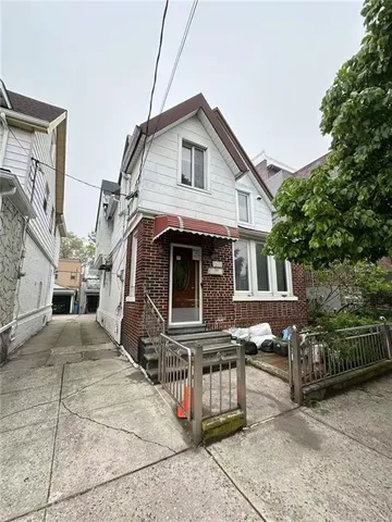 a front view of a house with garage