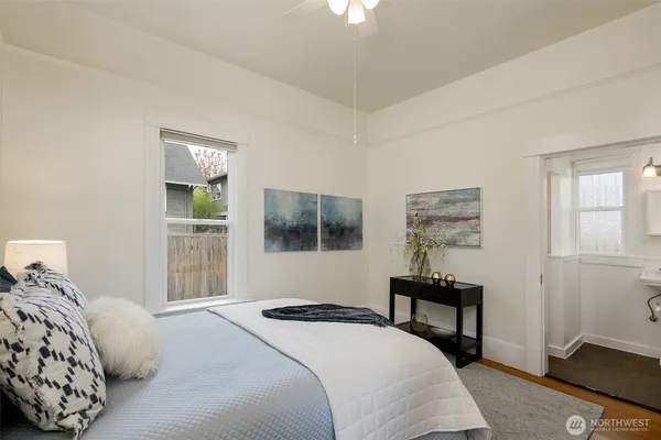 a bedroom with a bed and a window
