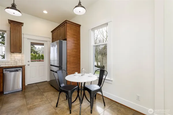 a kitchen with a table and chairs