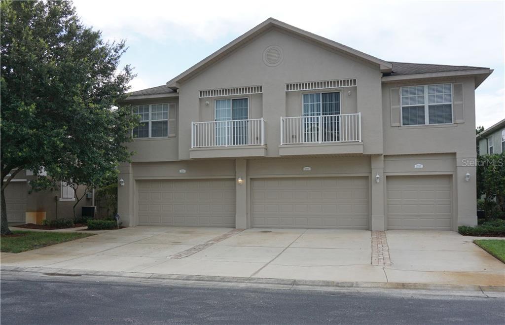 27819 Pleasure Ride Loop Wesley Chapel, FL 33544 - Photo 1 of 1 a front view of a house with garage
