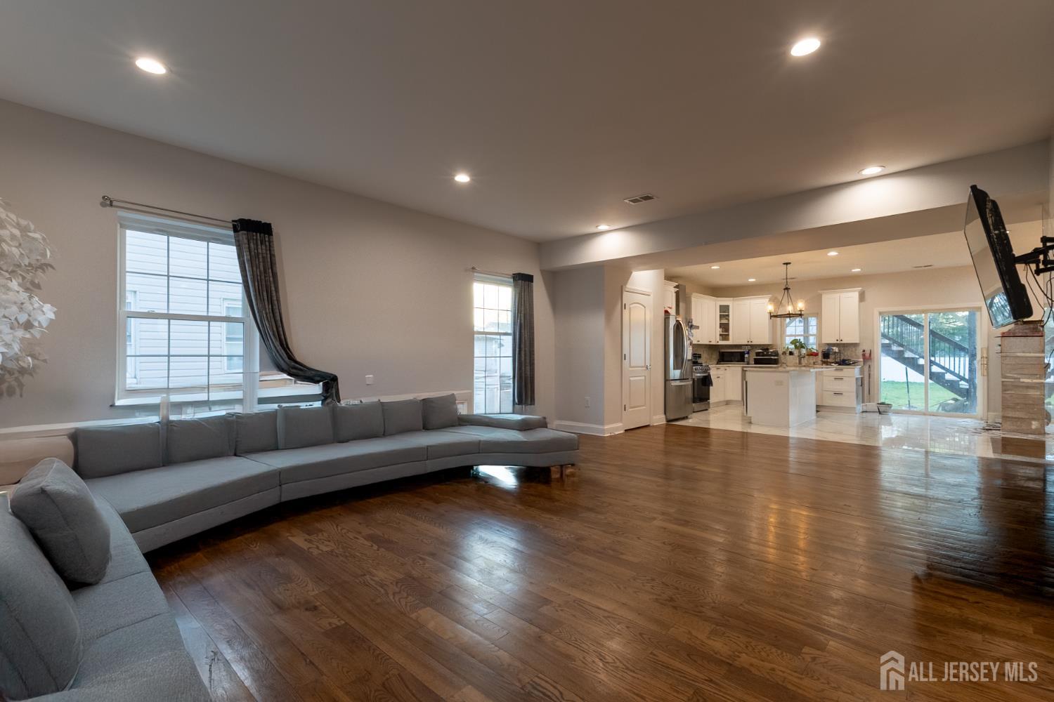 55 Walnut Street Edison, NJ 08817 - Photo 11 of 29 a living room with furniture and a large window