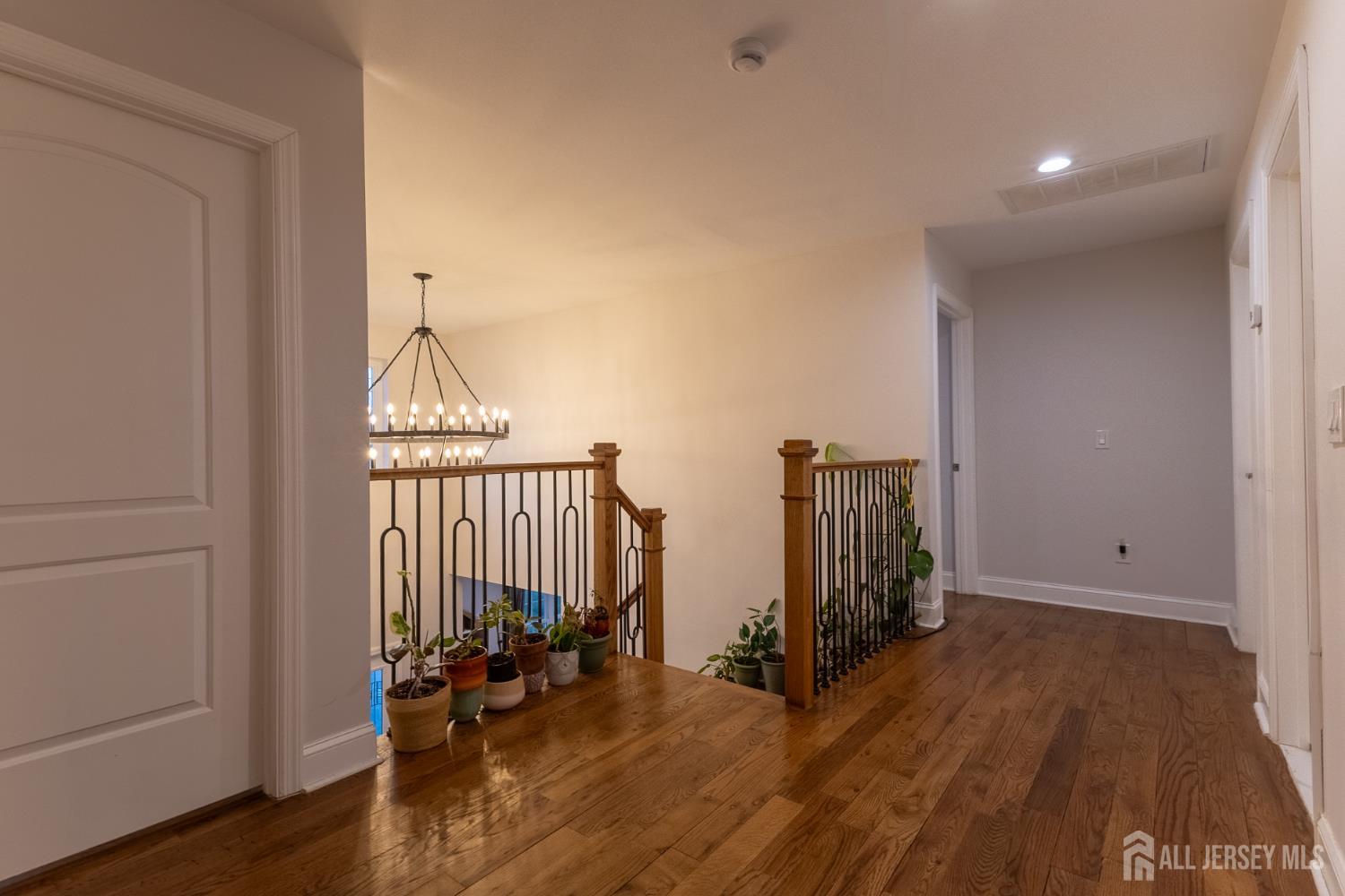 55 Walnut Street Edison, NJ 08817 - Photo 20 of 29 wooden floor in an empty room with a window