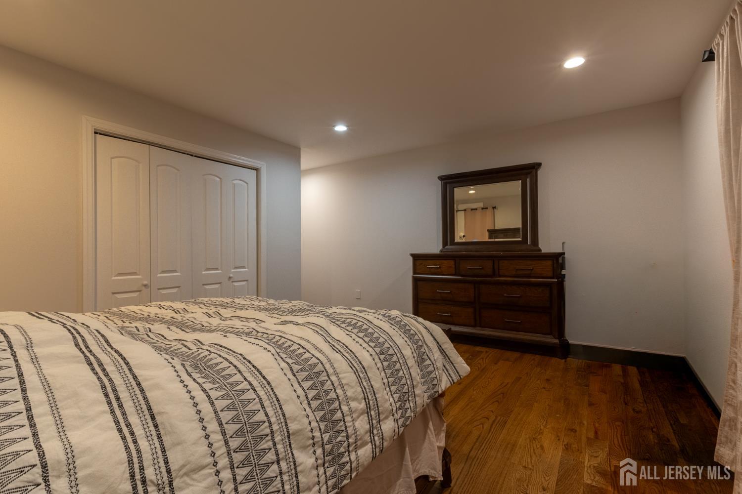 55 Walnut Street Edison, NJ 08817 - Photo 28 of 29 a bedroom with a bed and a dresser