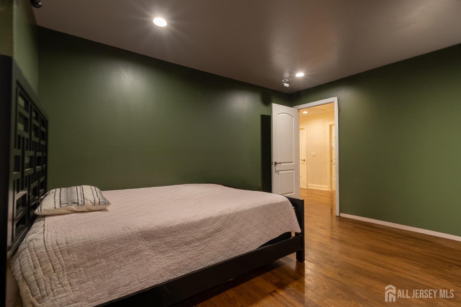 55 Walnut Street Edison, NJ 08817 - Photo 29 of 29 a bedroom with a bed and a table