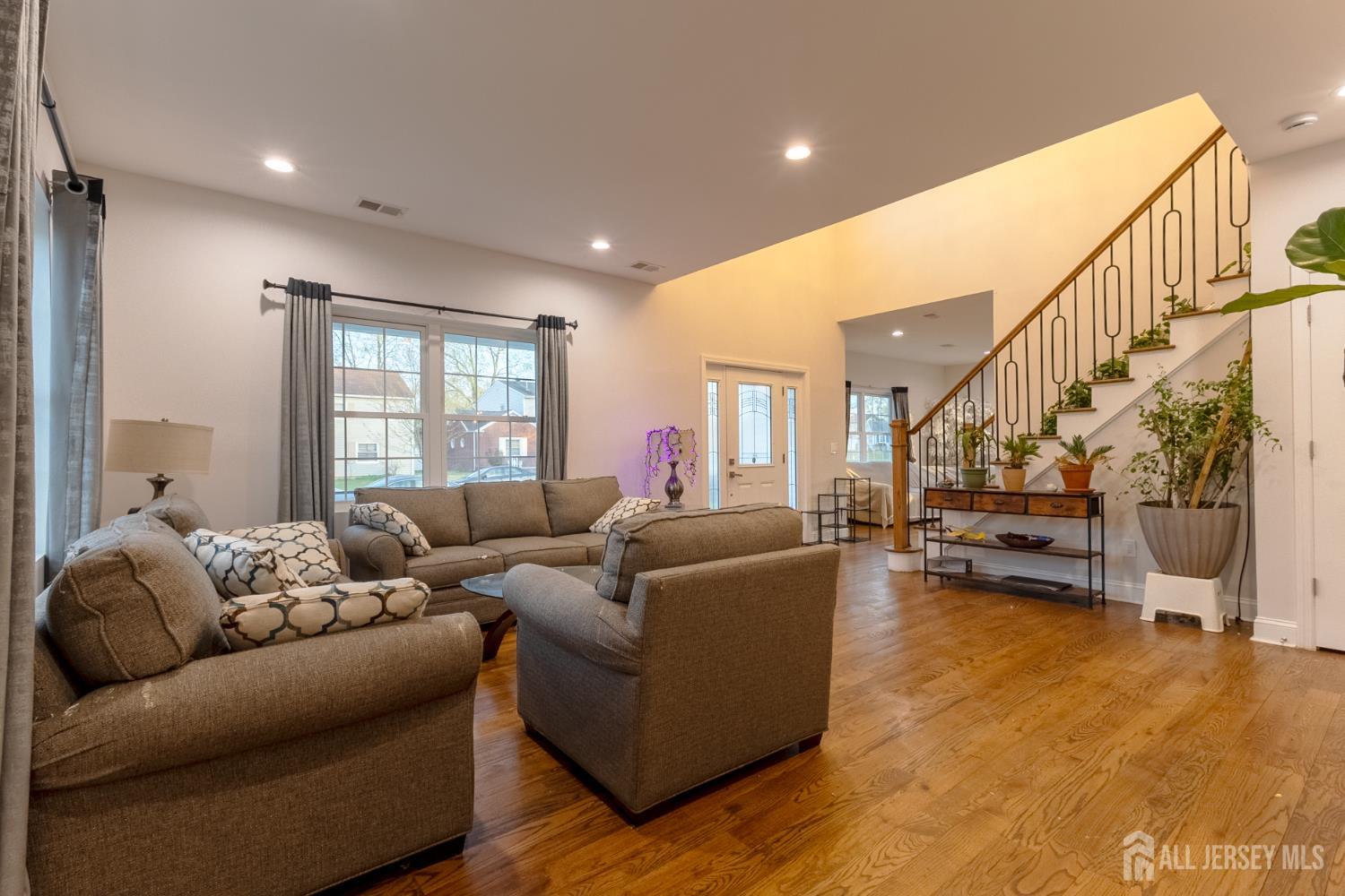 55 Walnut Street Edison, NJ 08817 - Photo 10 of 29 a living room with furniture and a flat screen tv