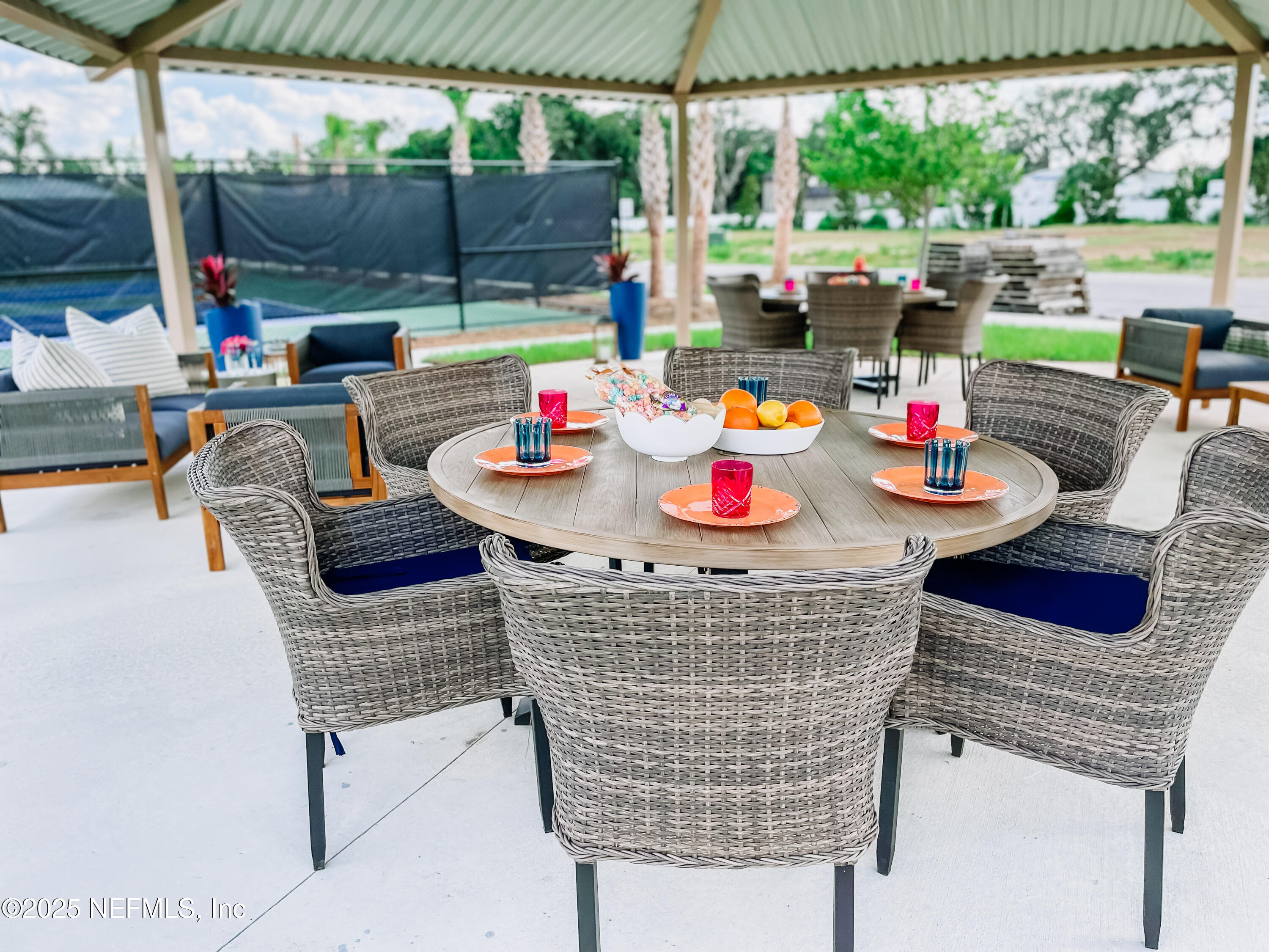 99 Pamplona Drive St. Augustine, FL 32086 - Photo 7 of 7 a table and chairs in the patio