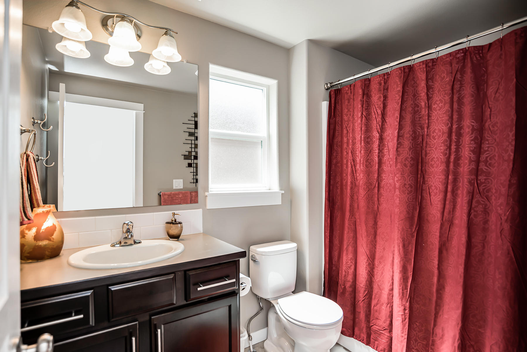 2546 Northwest Awbrey Road Bend, OR 97703 - Photo 16 of 22 a bathroom with a sink a toilet and mirror