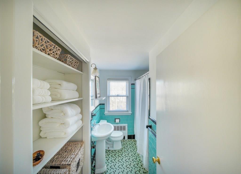 19 Anna Road Woburn, MA 01801 - Photo 8 of 9 a bathroom with a sink a toilet and shower