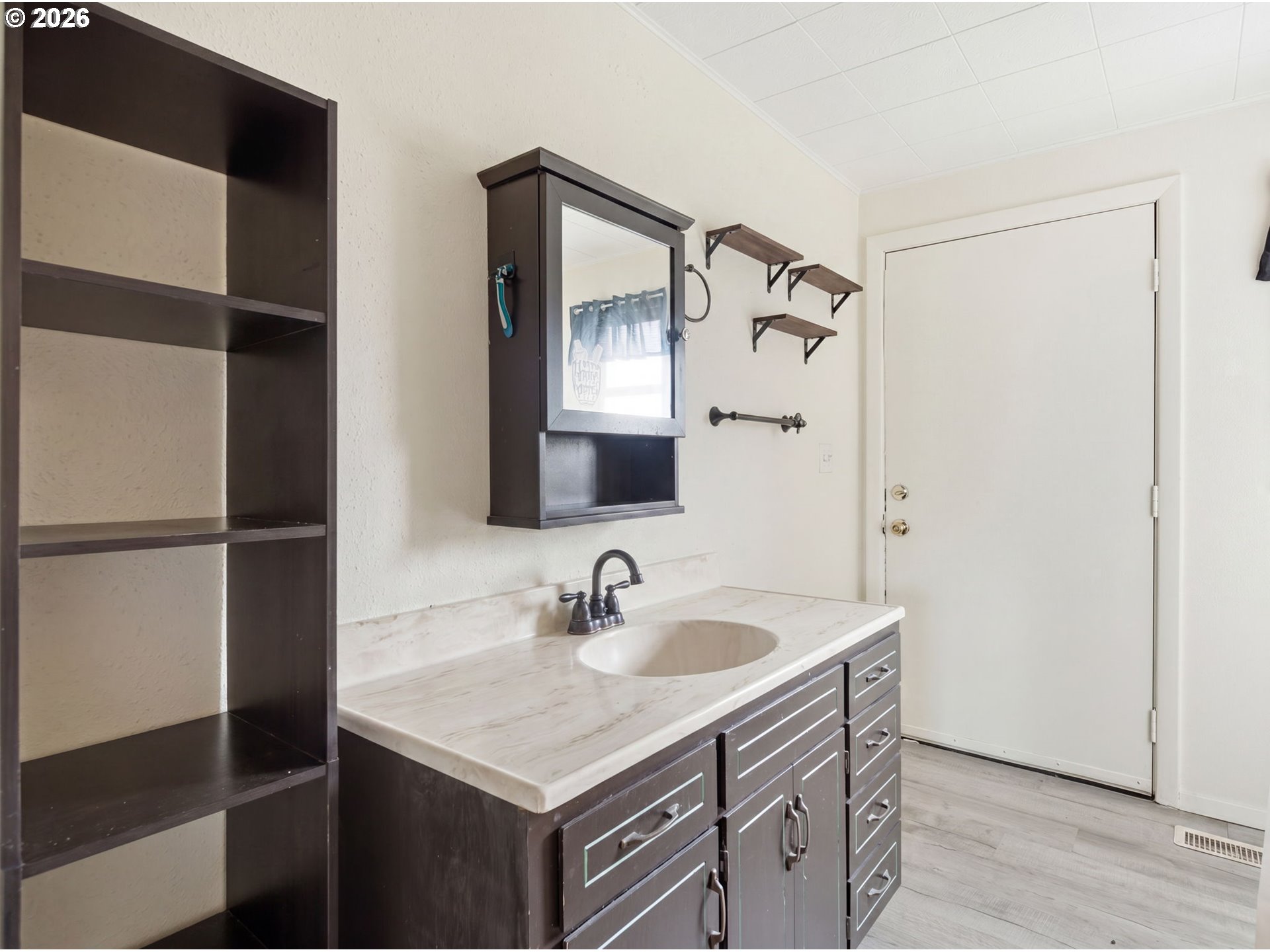 1357 Grove Street Lebanon, OR 97355 - Photo 20 of 37 a bathroom with a sink and a mirror