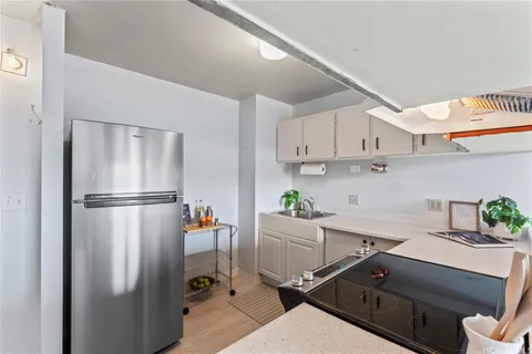 a kitchen with stainless steel appliances a refrigerator and a sink