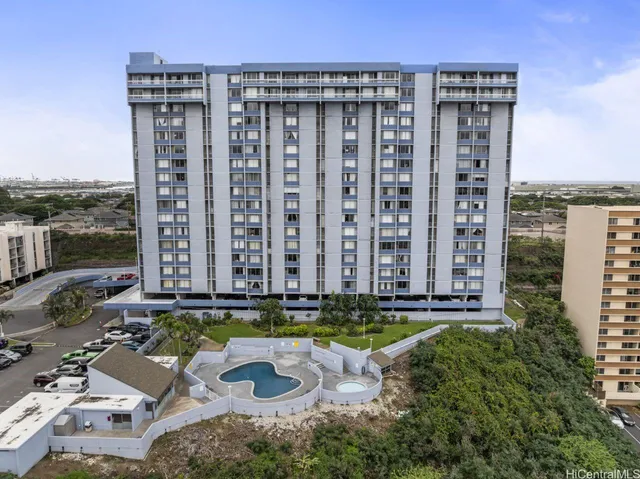 a view of a street with tall buildings