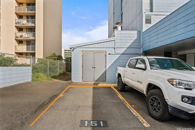 a view of a car parked front of a house