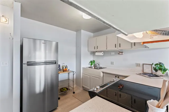 a kitchen with stainless steel appliances a refrigerator and a sink