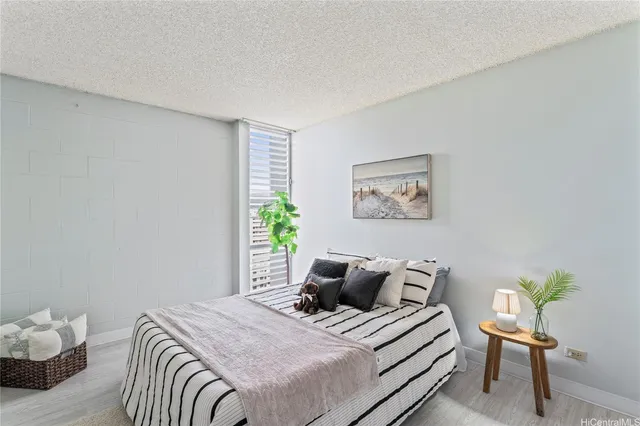 a bedroom with a bed and a chair