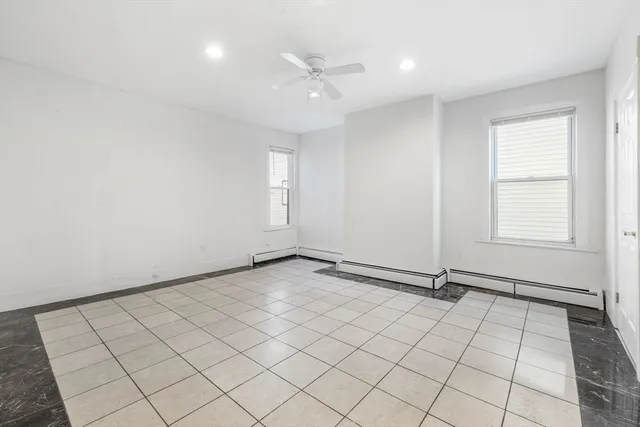 a kitchen with a stove top oven and cabinets