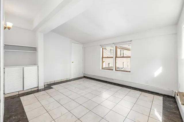 a bathroom with a shower sink and mirror