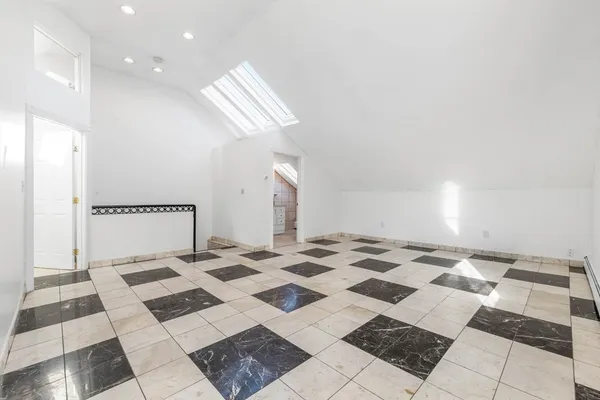 a view of a bathroom with a sink and a mirror